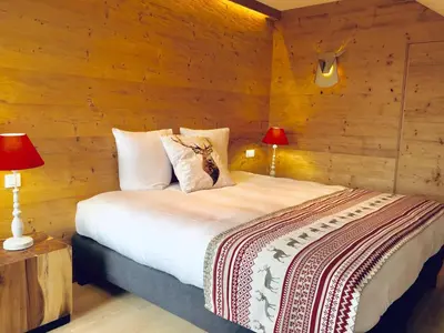 Un ou plusieurs lits dans un hébergement de l'établissement Chalet Le Flocon Bleu - Mauselaine avec vue sur le Lac de Gérardmer