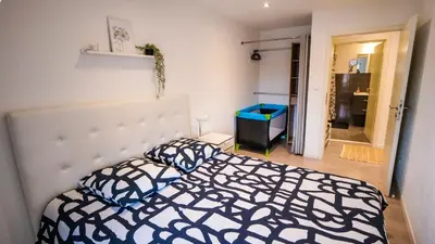 Un ou plusieurs lits dans un hébergement de l'établissement Le 4 - Très beau appartement T3 Neuf, tout confort, Mulhouse centre ville - stationnement gratuit