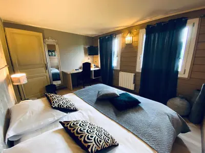 Un ou plusieurs lits dans un hébergement de l'établissement Le Chalet d'Etienne