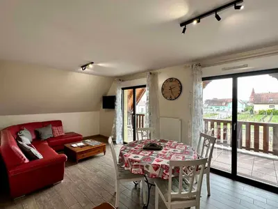 Coin salon dans l'établissement Les Chambres Du Vignoble
