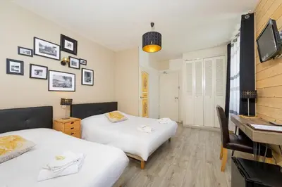 Un ou plusieurs lits dans un hébergement de l'établissement Hôtel Restaurant l'Aubergade