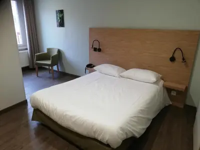 Un ou plusieurs lits dans un hébergement de l'établissement Hôtel Restaurant Le Moschenross