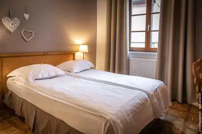 Un ou plusieurs lits dans un hébergement de l'établissement Hôtel le Saint Nicolas