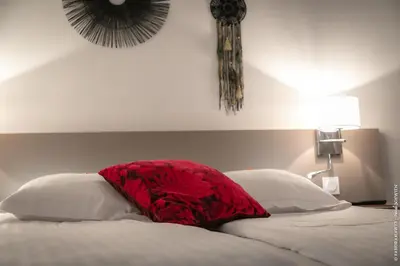 Un ou plusieurs lits dans un hébergement de l'établissement Hôtel le Saint Nicolas