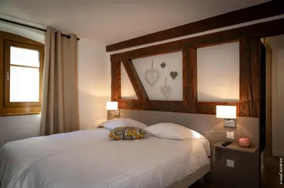 Un ou plusieurs lits dans un hébergement de l'établissement Hôtel le Saint Nicolas