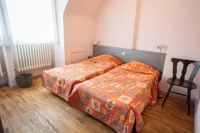 Un ou plusieurs lits dans un hébergement de l'établissement Hôtel du Ladhof