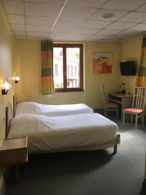 Un ou plusieurs lits dans un hébergement de l'établissement Hostellerie d'Alsace