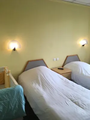 Un ou plusieurs lits dans un hébergement de l'établissement Hostellerie d'Alsace