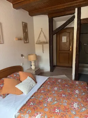 Un ou plusieurs lits dans un hébergement de l'établissement Chambres - zimmer Wistub Le PasSage