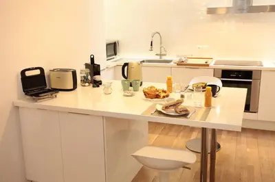 Cuisine ou kitchenette dans l'établissement Honey-Sorgatina