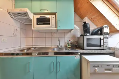 Cuisine ou kitchenette dans l'établissement Gîte à La Montagne