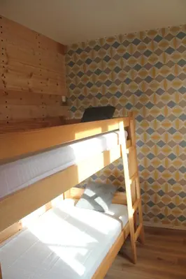 Un ou plusieurs lits dans un hébergement de l'établissement Chalet du Toit Vosgien