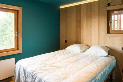 Un ou plusieurs lits dans un hébergement de l'établissement Chalet des sorbiers