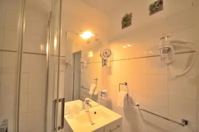Salle de bains dans l'établissement Hôtel Vauban