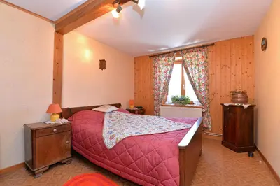 Un ou plusieurs lits dans un hébergement de l'établissement Gites ou Chambres d'hôtes à la ferme