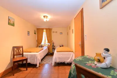 Un ou plusieurs lits dans un hébergement de l'établissement Gites ou Chambres d'hôtes à la ferme
