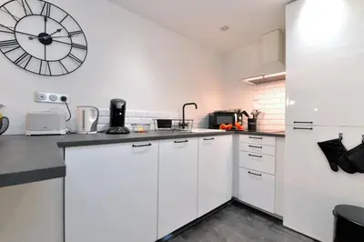 Cuisine ou kitchenette dans l'établissement La Petite Terrasse du Centre