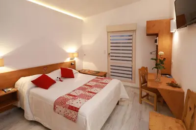 Un ou plusieurs lits dans un hébergement de l'établissement Hotel Restaurant 3 Châteaux