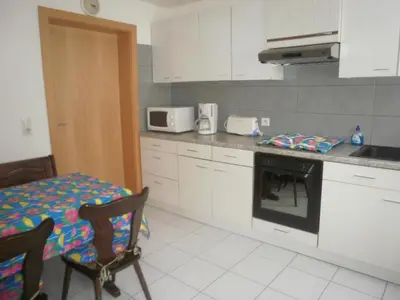 Cuisine ou kitchenette dans l'établissement Maison bleue Petermann