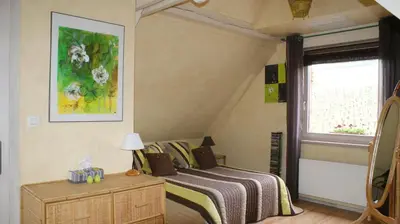 Un ou plusieurs lits dans un hébergement de l'établissement Chambre d'Hotes Le Vogelgarten