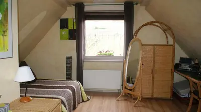 Un ou plusieurs lits dans un hébergement de l'établissement Chambre d'Hotes Le Vogelgarten