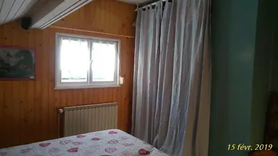 Un ou plusieurs lits dans un hébergement de l'établissement Gîte 60M2