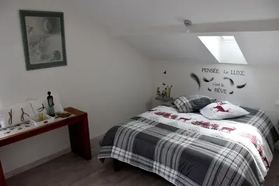 Un ou plusieurs lits dans un hébergement de l'établissement Gîte 60M2