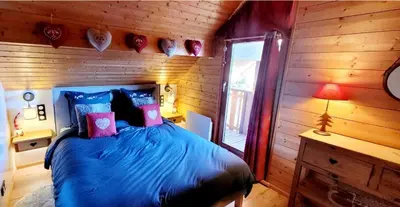 Un ou plusieurs lits dans un hébergement de l'établissement Chalet de la Grimpette au coeur de Gérardmer