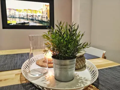 Télévision ou salle de divertissement dans l'établissement Au p'tit Cordonnier