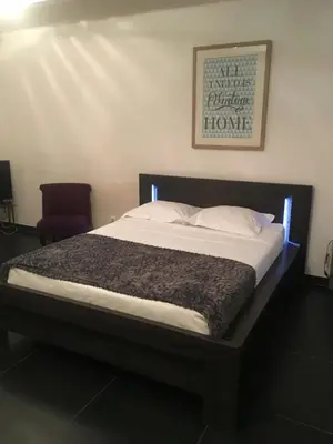 Un ou plusieurs lits dans un hébergement de l'établissement Les Appartements Berthe Molly