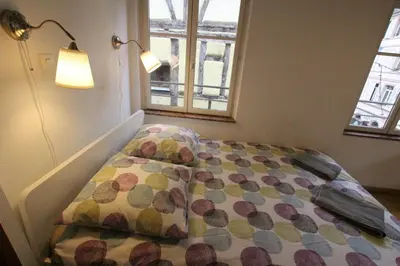 Un ou plusieurs lits dans un hébergement de l'établissement Colmar Historic Center - Alsacian Appartement PETITE VENISE 2 - BookingAlsace