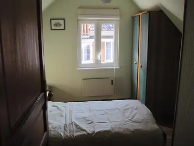 Un ou plusieurs lits dans un hébergement de l'établissement LA MAISON FLEURIE Gîtes du Florimont