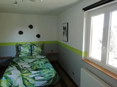 Un ou plusieurs lits dans un hébergement de l'établissement Maison / villa complète à 5 minutes de Colmar
