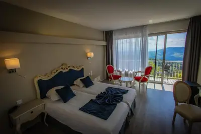 Un ou plusieurs lits dans un hébergement de l'établissement Alexain Hotel Restaurant & Wellness - Colmar Ouest