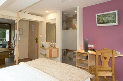 Un ou plusieurs lits dans un hébergement de l'établissement Hostellerie Les Bagenelles