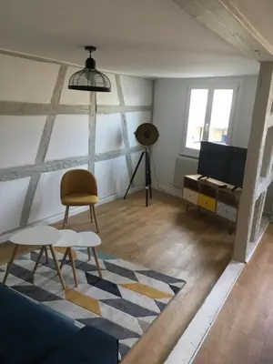 Coin salon dans l'établissement Les Appartements de Home Petite Venise