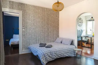 Un ou plusieurs lits dans un hébergement de l'établissement Gîte Hopla 2 chambres