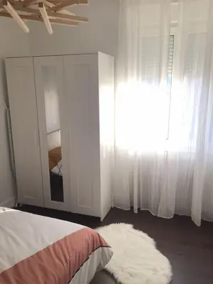 Un ou plusieurs lits dans un hébergement de l'établissement Gîte Hopla 2 chambres