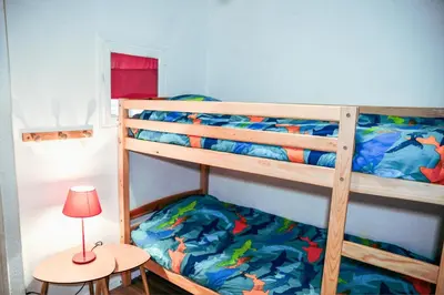 Un ou plusieurs lits dans un hébergement de l'établissement Le Cosy