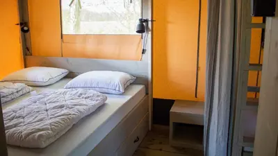 Un ou plusieurs lits dans un hébergement de l'établissement Glamping the Vosges