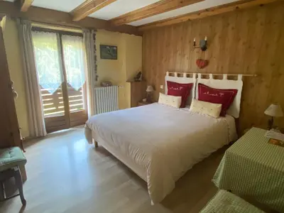 Un ou plusieurs lits dans un hébergement de l'établissement Chambres d'Hôtes des Cascades St-Nicolas