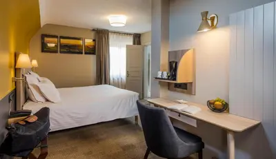 Un ou plusieurs lits dans un hébergement de l'établissement Hotel Restaurant Au Riesling