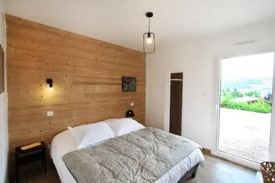 Un ou plusieurs lits dans un hébergement de l'établissement Le Balcon des Lumières