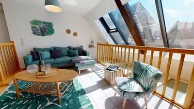 Coin salon dans l'établissement Duplex des Dominicains - 1 Parking GRATUIT - Hypercentre 6 personnes