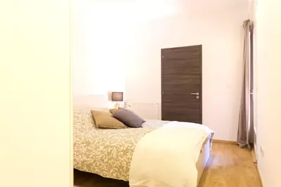 Un ou plusieurs lits dans un hébergement de l'établissement Appartement grand standing VAUBAN 10 Personnes centre historique de Colmar