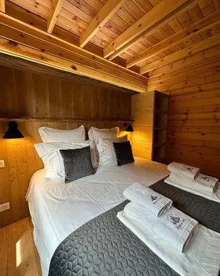 Un ou plusieurs lits dans un hébergement de l'établissement Chalet Le Familial - SPA & SAUNA - Serviettes - Peignoirs - Lits faits - Ménage inclus