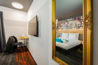 Un ou plusieurs lits dans un hébergement de l'établissement Berti Hotel - Mulhouse Centre Gare