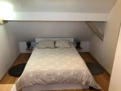 Un ou plusieurs lits dans un hébergement de l'établissement Gîte Chez Mathilde - hébergement de charme alliant cachet et modernité à 5 minutes de Colmar