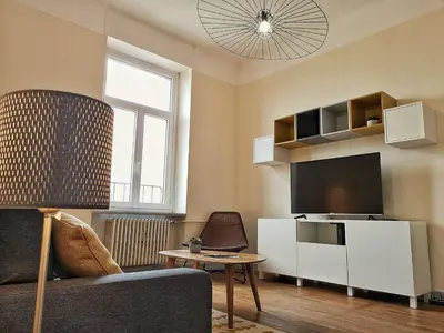 Télévision ou salle de divertissement dans l'établissement Le XI - Suite Colmar Gare