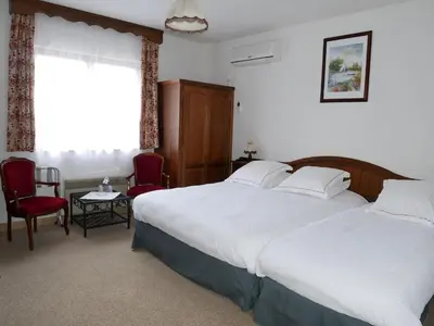 Un ou plusieurs lits dans un hébergement de l'établissement Hotel-Spa & Restaurant Logis Domaine Langmatt